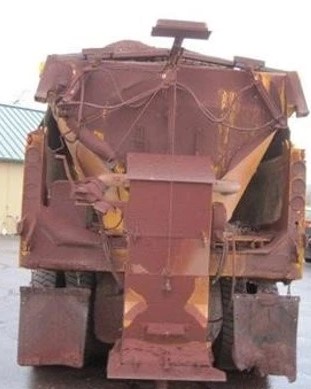 An image of the back of a PennDOT plow truck all rusted as a result of buildup from winter weather events